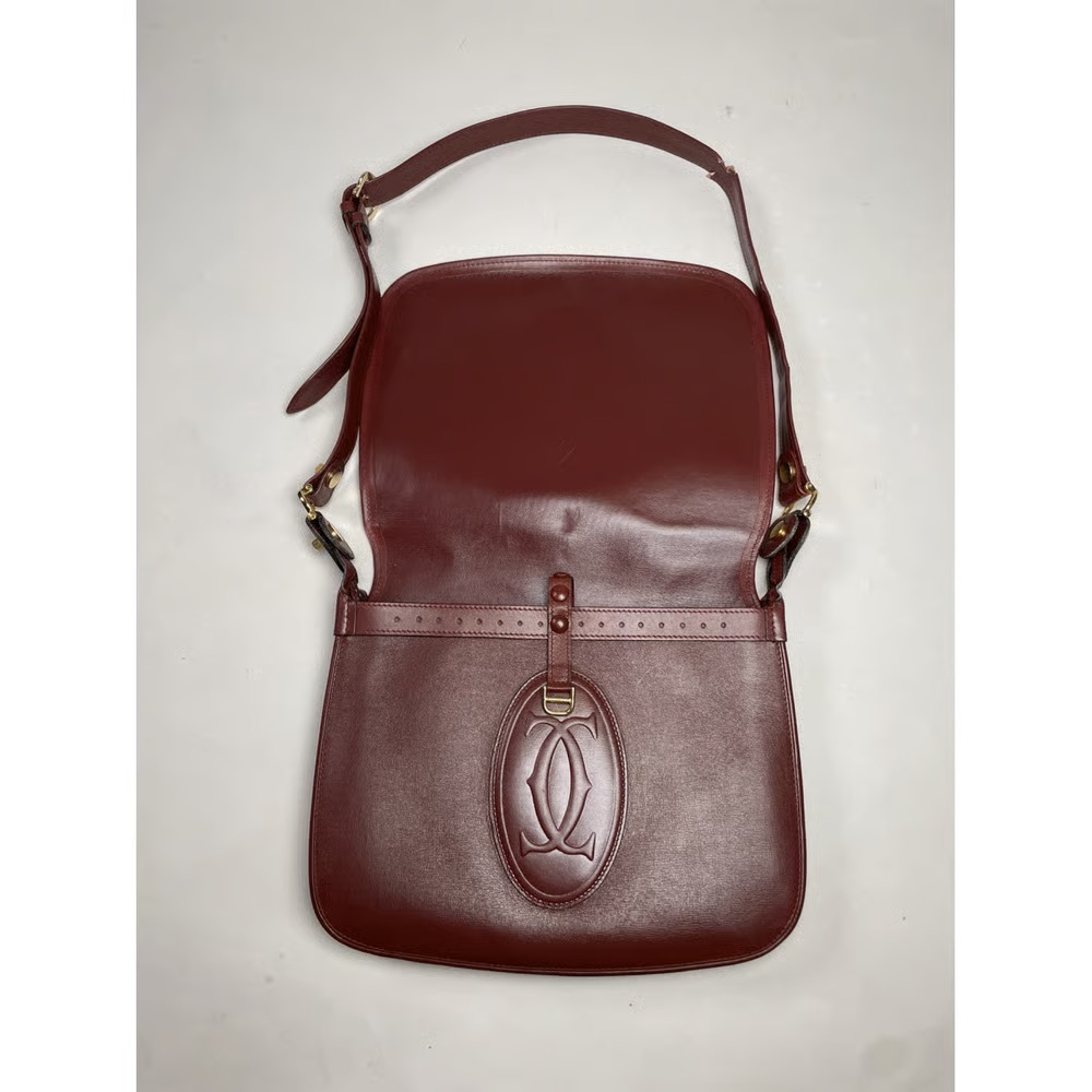 Authentic Must de Cartier leather handbag